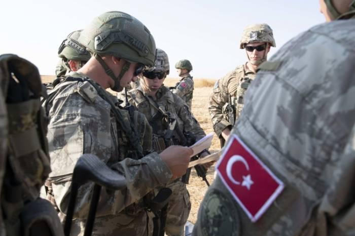 Минобороны Турции сообщило о выведении террористов с сирийского города Рас эль-Айн
