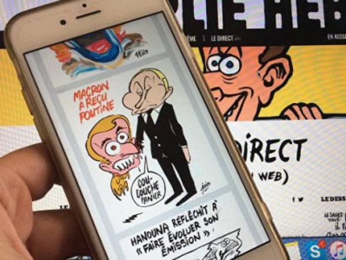 Charlie Hebdo изобразил Макрона щенком, кусающим Путина